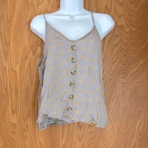 Gray and yellow colored tank top with buttons
